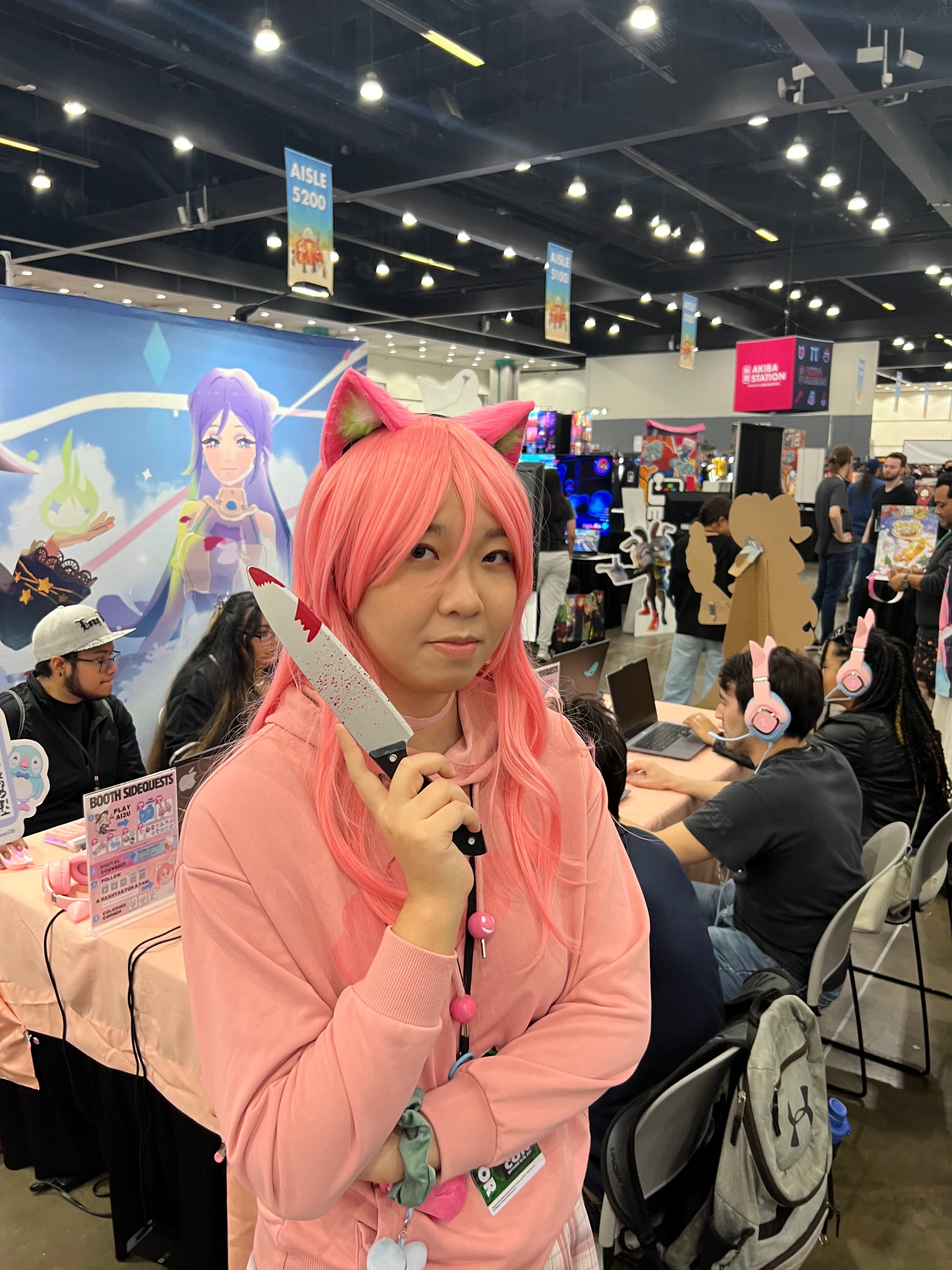 AI2U cosplayers posing inside the convention